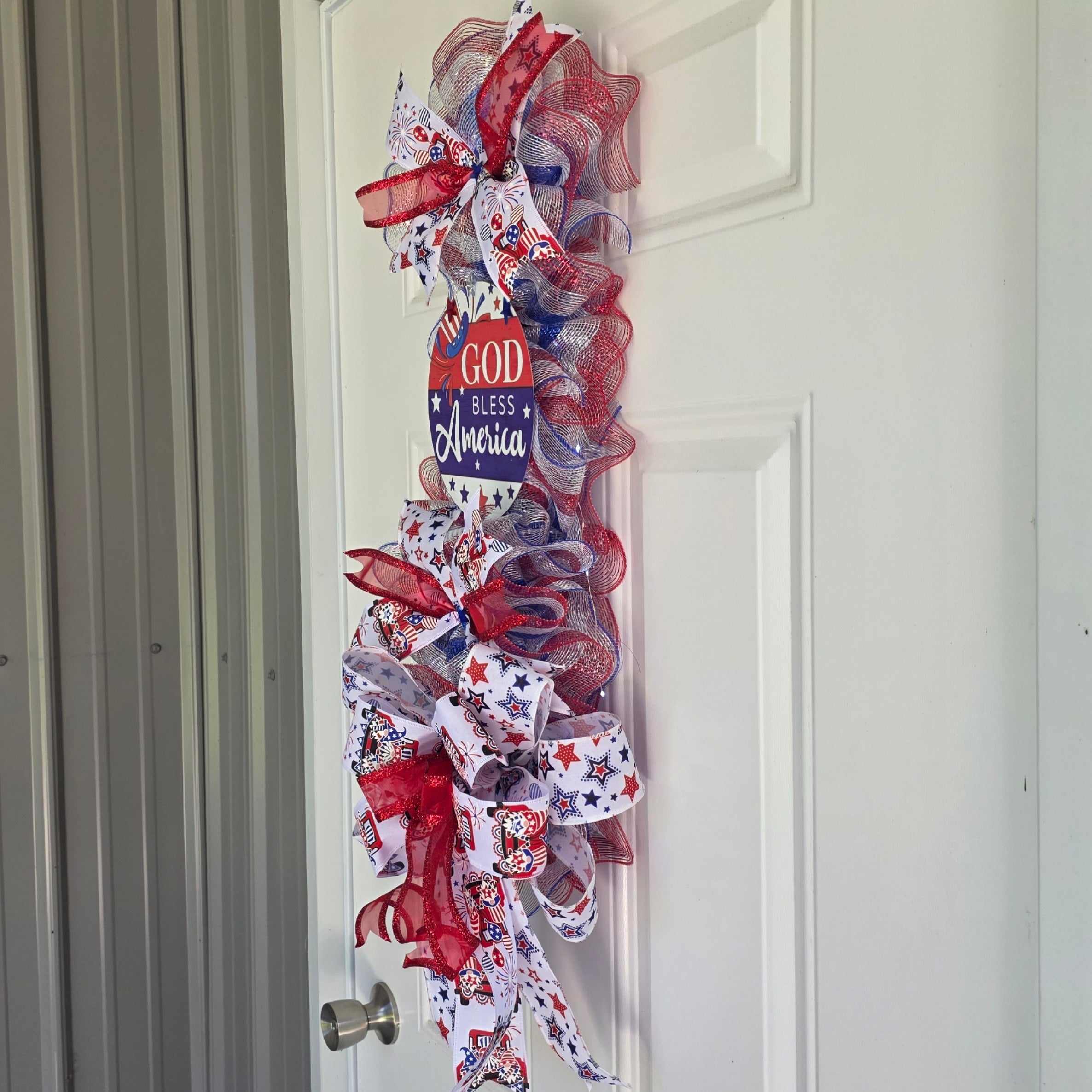 Right side view of God Bless America patriotic door swag