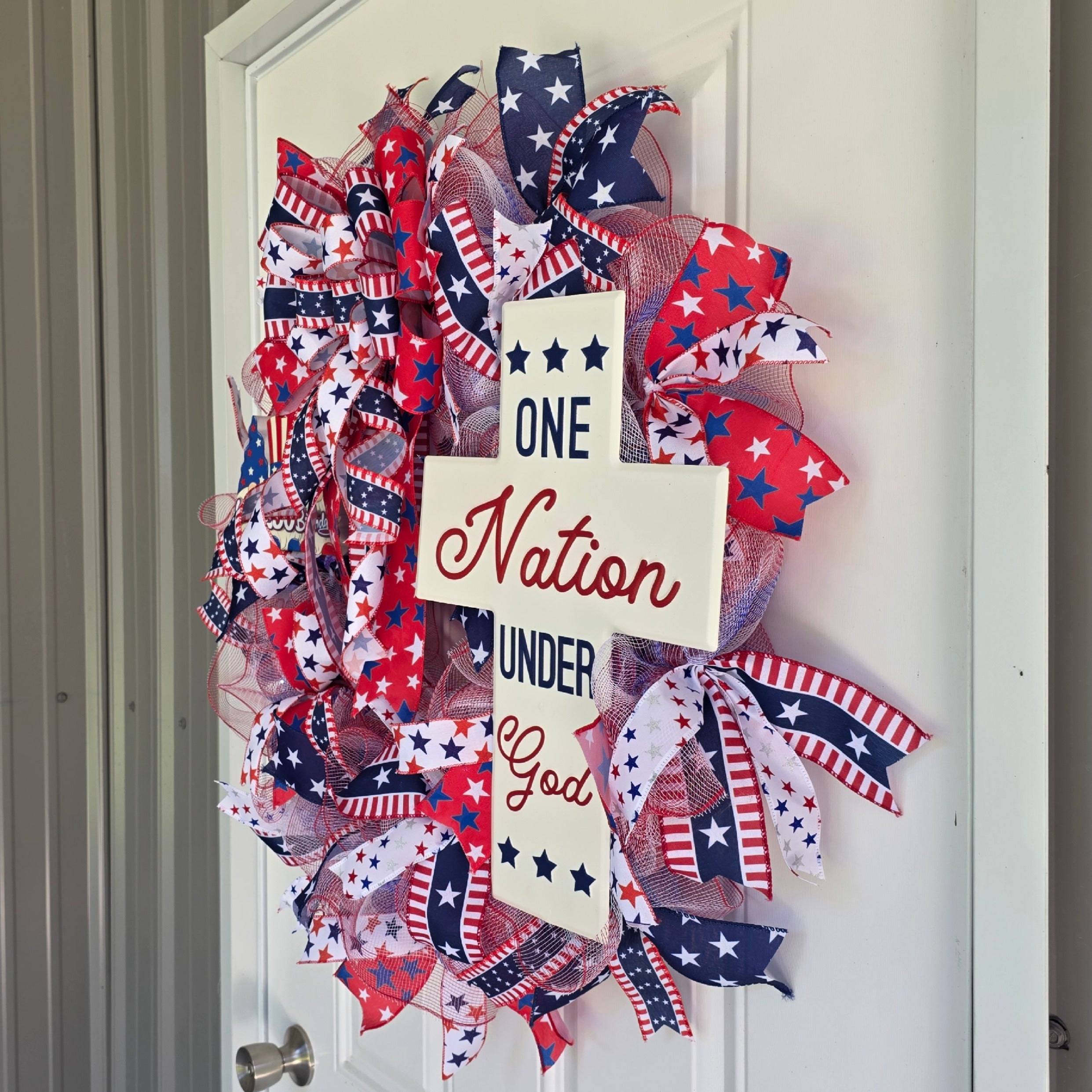 Right side view of One Nation Under God patriotic wreath on door
