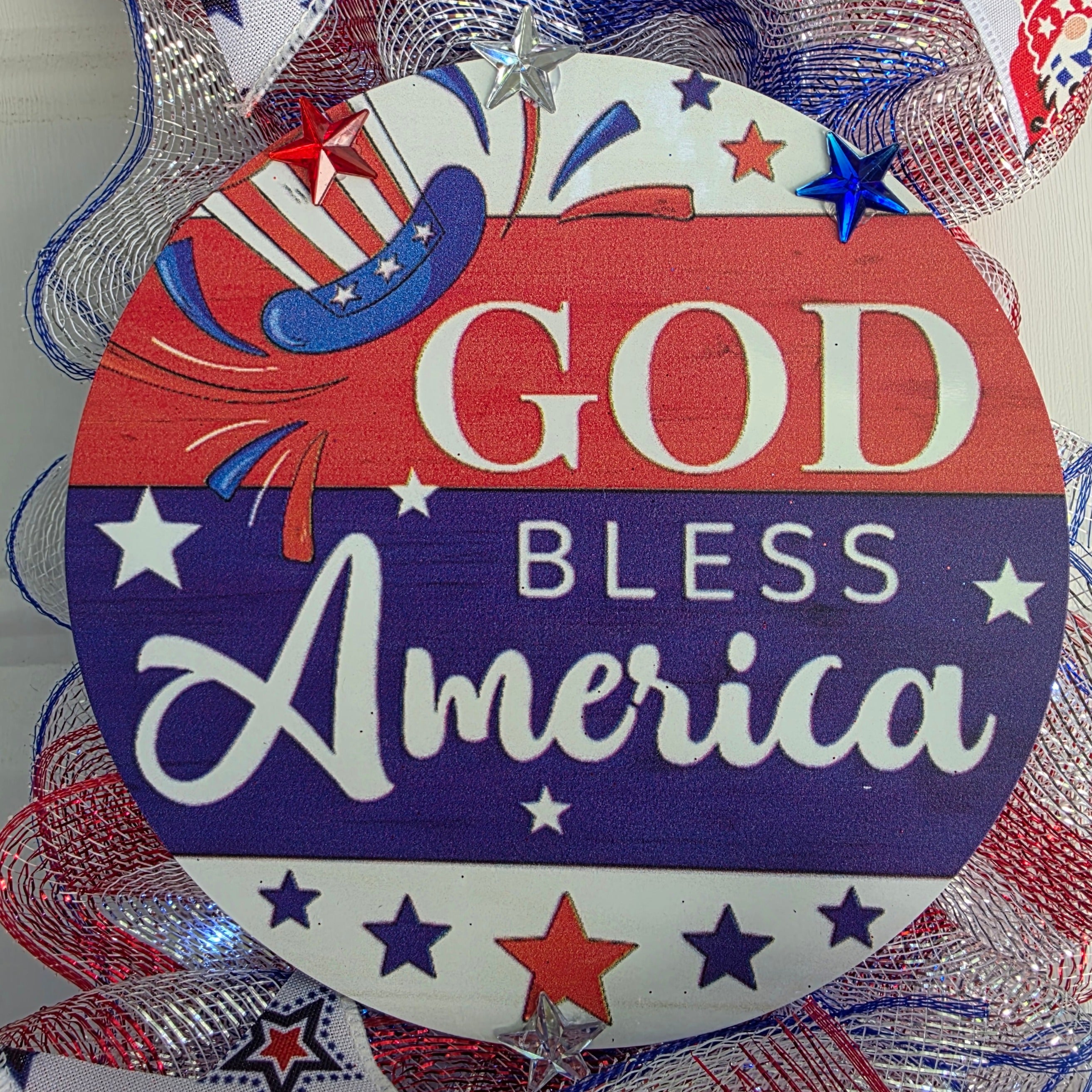 Close-up of God Bless America round center sign with glittery star accents