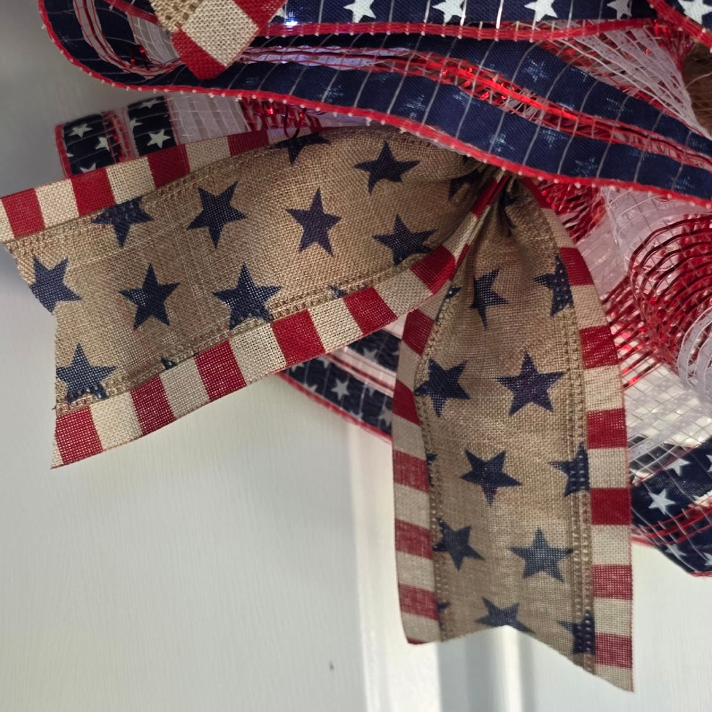 Navy star ribbon detail woven throughout the wreath