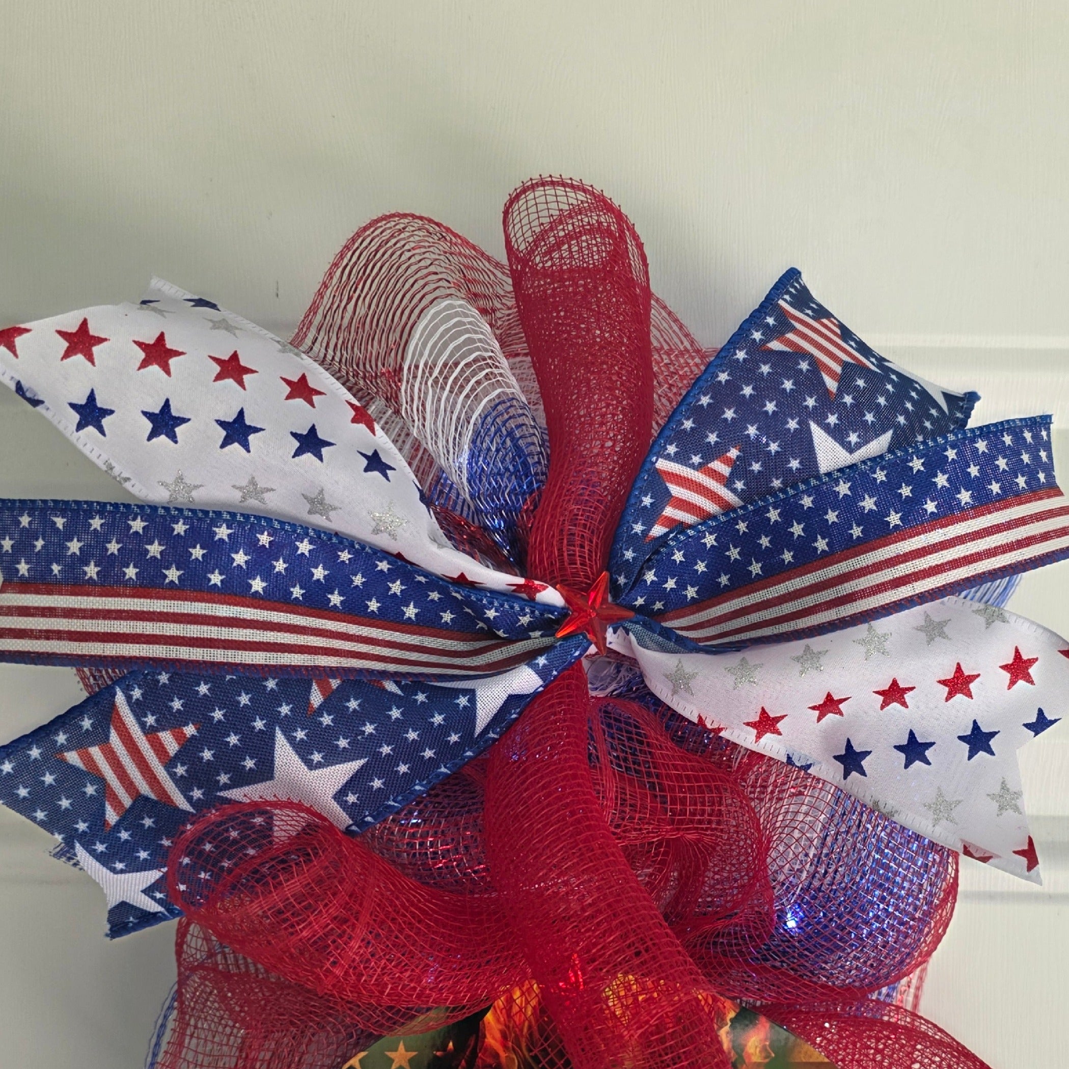Top ribbon detail showing layered patriotic wired ribbons